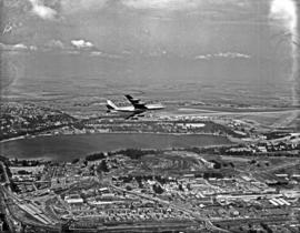 Johannesburg, 1960. Rand Airport. SAA Boeing 707 ZS-CKC 'Cape Town' in flight over Rand Airport. ...