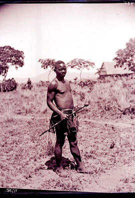 Man with knob kierie at Great Zimbabwe.