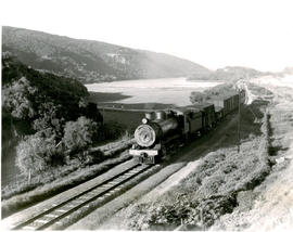 Wilderness, 1952. SAR Class 8 with goods train just having crossed the lagoon.
