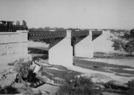 Kendrew. Cape 4th Class, later SAR Class 04 locomotive on bridge with stone piers and three spans...