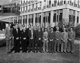 Johannesburg, circa 1979. Group of men outside building.