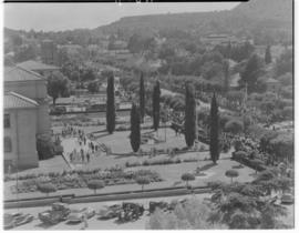 Bloemfontein, 7 March 1947. Royal party walking through formal garden.