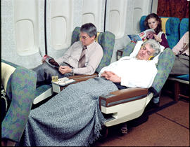 SAA boeing 747 interior. Passenger in reclining seat.