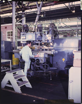 Fitter and turner at milling machine.