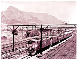 Cape Town, 1978. Three SAR Class 5E1 Srs 1's on 2221down new Blue Train leaving Cape Town passing...