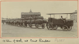 East London. Tractor with row of trailers stacked with 13 tonnes of wool.
