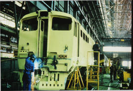 SAR Class 5E1 Srs 5 undergoing general overhaul and fitting of sealed beam headlamp in locomotive...
