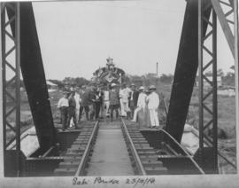 Kruger National Park, 23 April 1910. Group of dignitaries with decorated locomotive.