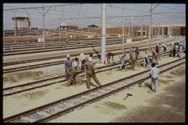 Bapsfontein, December 1982. Workers ballasting the lines at Sentrarand marshalling yard. [T Robbe...