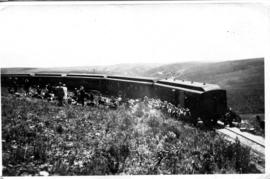 Passenger coaches in mountain pass with passengers outside. (Lund collection)