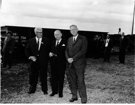 Circa 1970. Dr Loubser with two men next to SAR wagon.