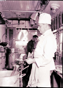 
Chef at work in dining car kitchen on the Union Limited.
