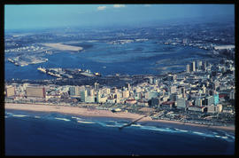 Durban, July 1968. Aerial view of beachfront and Durban Harbour. [HH Kruger]