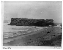 Durban, circa 1901. Large rock in the ocean. (Durban Harbour album of CBP Lewis)
