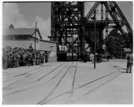 Johannesburg, 5 April 1947. Mining headgear and waiting crowd at Rand Gold Mine..