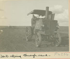 Brandfort district. SAR tractor roping wagon through sand.